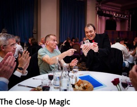 The French magician Boris Wild performing close-up magic at the table of the guests